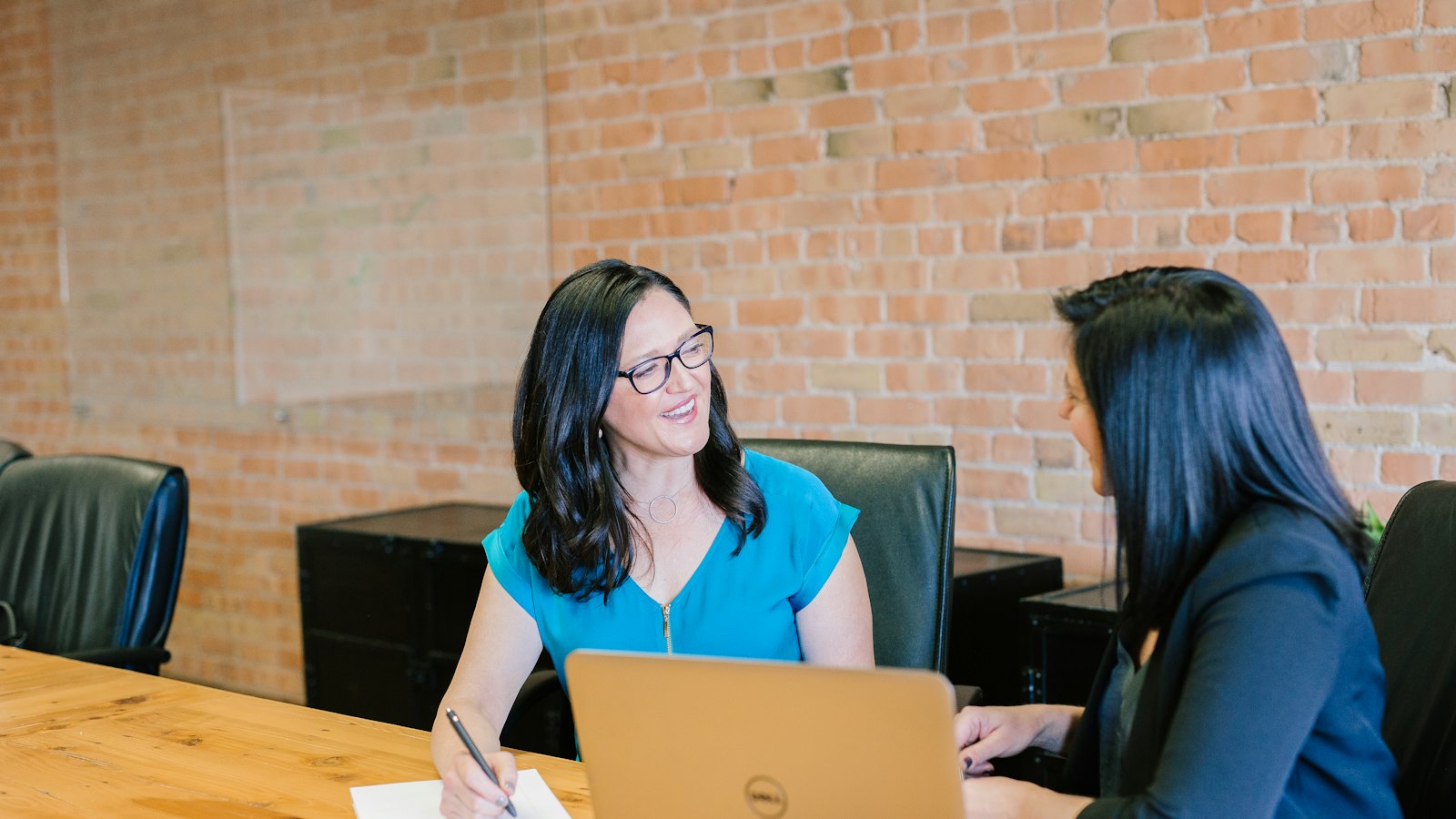 A coach and client in an attentive one-to-one conversation